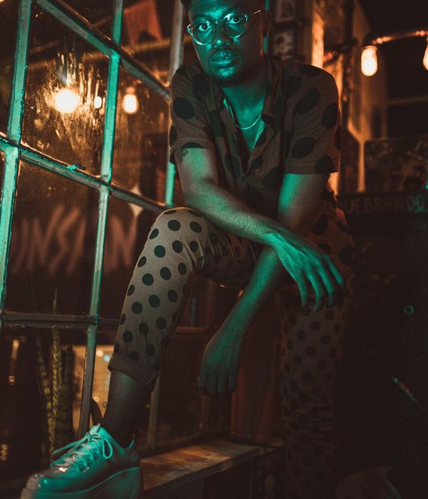 Man with dark hair wearing eyeglasses and casual professional clothing