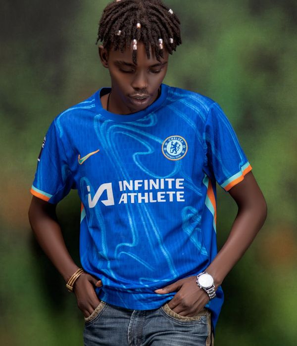 Man with trimmed facial hair and approachable demeanor in smart casual wear