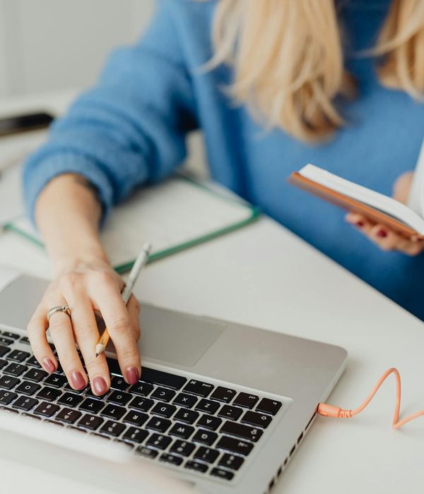 Person studying with organized digital workspace and learning materials