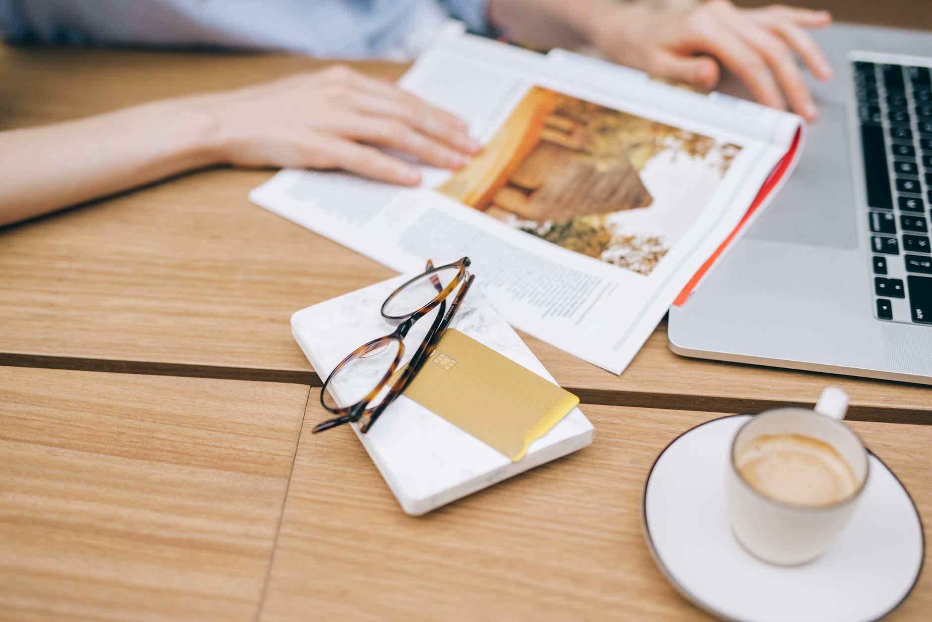 Person working at organized desk with learning materials and digital devices